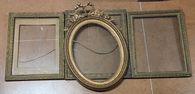 three frames that are sitting on the floor next to each other