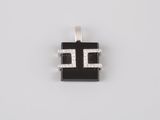 a black and white pendant with diamonds on a white background
