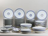 many plates and bowls with blue and white designs on them