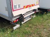 a white truck that is parked on the side of the road