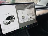 dashboard of a car with a computer screen showing a car ' s interior