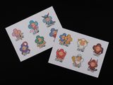 two stickers with cartoon characters on them sitting next to each other