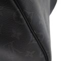 a close up of a black leather bag with a zipper
