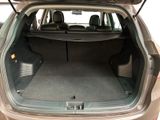 the back of a car with the trunk open and the seats down