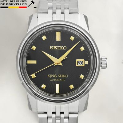 an image of a close up of a watch on a white surface