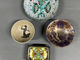three bowls and a bowl with a picture of a woman on them
