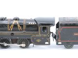 a toy train that is sitting on a white surface