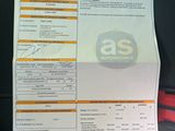a picture of a car ' s driver ' s license and information card