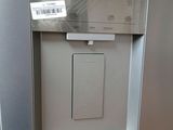 an image of a stainless steel refrigerator with a label on the door