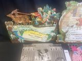 a box with a picture of a christmas scene inside of it