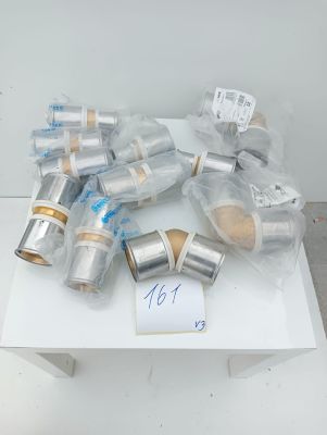 a lot of silver and gold items on a white table