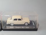 a small toy car in a clear case on a table