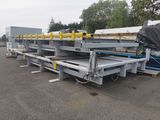 a close up of a flatbed trailer parked in a parking lot