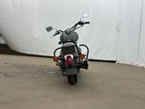a motorcycle that is parked in front of a tent