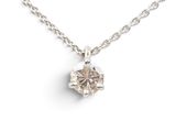 a diamond pendant on a silver chain on a white background