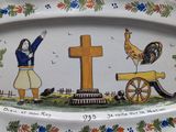 a plate with a picture of a woman and a rooster on it