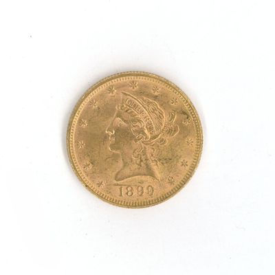 une image d'une pièce d'or sur une surface blanche