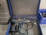 a tool box with tools in it sitting on the floor