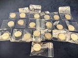 some of the gold coins are in plastic bags on a table