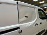 a white van that is parked in a garage