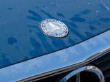 a close up of a mercedes logo on a car