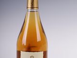 an image of a bottle of wine sitting on top of a table