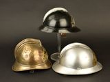 three helmets sitting next to each other on a table