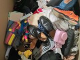 a box full of clothes and shoes in it