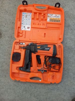 a tool kit in the orange case on the floor