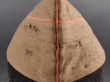 an image of a brown hat with a red line on it