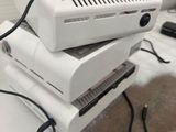 three computers stacked on top of each other on a table