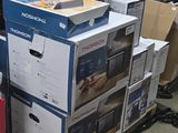 many boxes stacked on top of each other on the floor