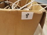 a cardboard box with a bunch of wires in it