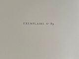 an open book with the title exemplaire no 8 written on it