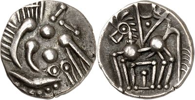 a close up of a silver coin with an image of a person on it