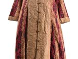 an image of a woman ' s dress on a mannequin stand