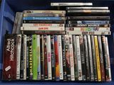 many dvds in a blue box on a table