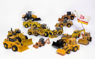 de nombreux engins de chantier miniatures posés sur une surface blanche
