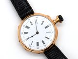 an image of a close up of a wrist watch with roman numerals