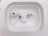 a picture of an airpods in a bathroom sink