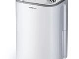 a white portable air conditioner sitting on top of a white floor