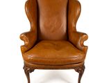 une image d'une chaise en cuir marron sur fond blanc
