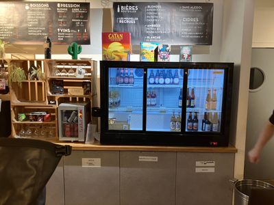 a man standing in front of a television in a store