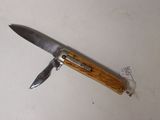 a small knife that is laying on a table