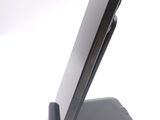 a cell phone that is sitting on top of a stand