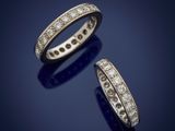 a pair of diamond eternity rings, by cartier