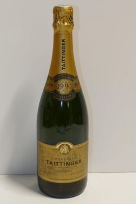 a close up of a bottle of champagne on a table