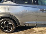 a silver car parked on the side of the road