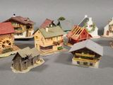 a lot of miniature houses that are sitting on a table