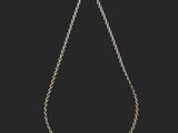 a silver necklace with a chain on a black background